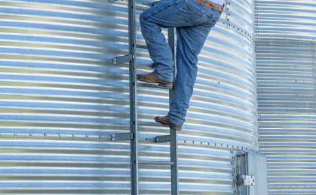 Ben Bellar inspects a grain bin.